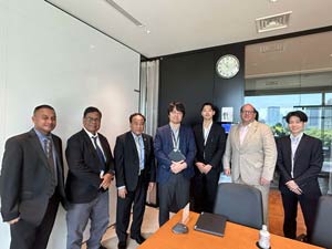 posing with Marubeni officials after meeting